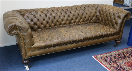A Victorian chesterfield settee covered in deep-buttoned hide W.220cm